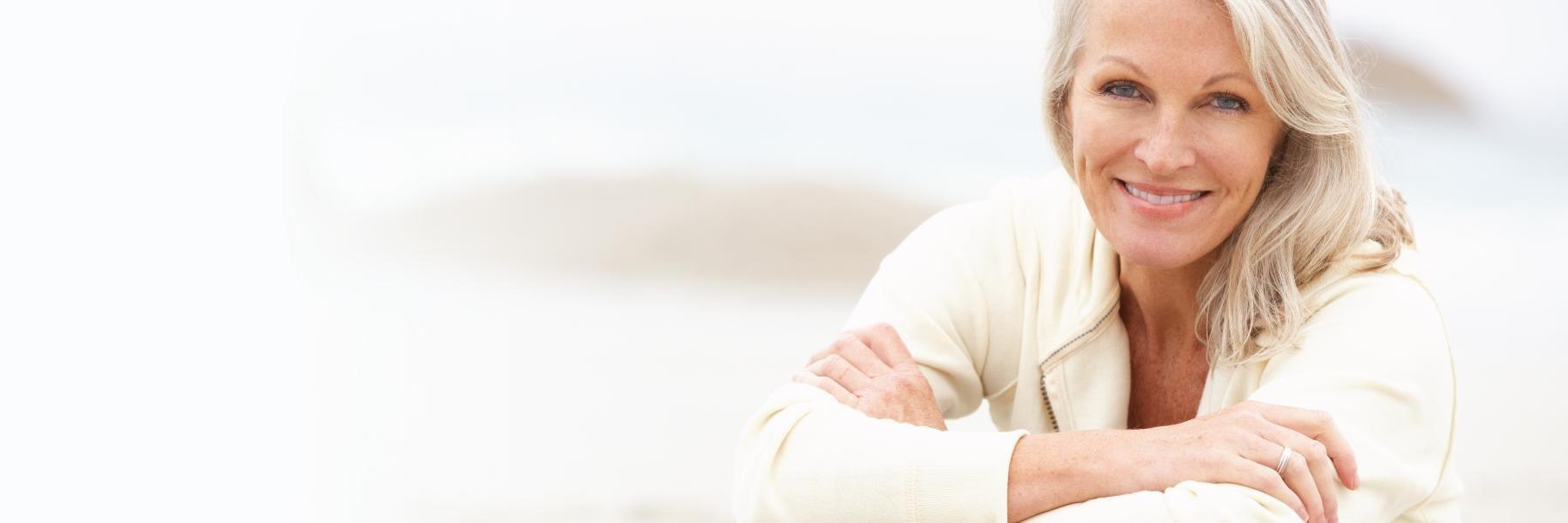 Older woman with long hair smiling